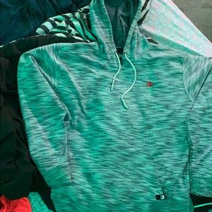 Sweater like fabric with a rose design hoodie.